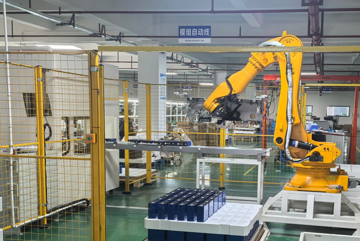 Advanced robotic arm assembling LiFePO4 battery modules on the automated production line at the Gotopower Dongguan factory.