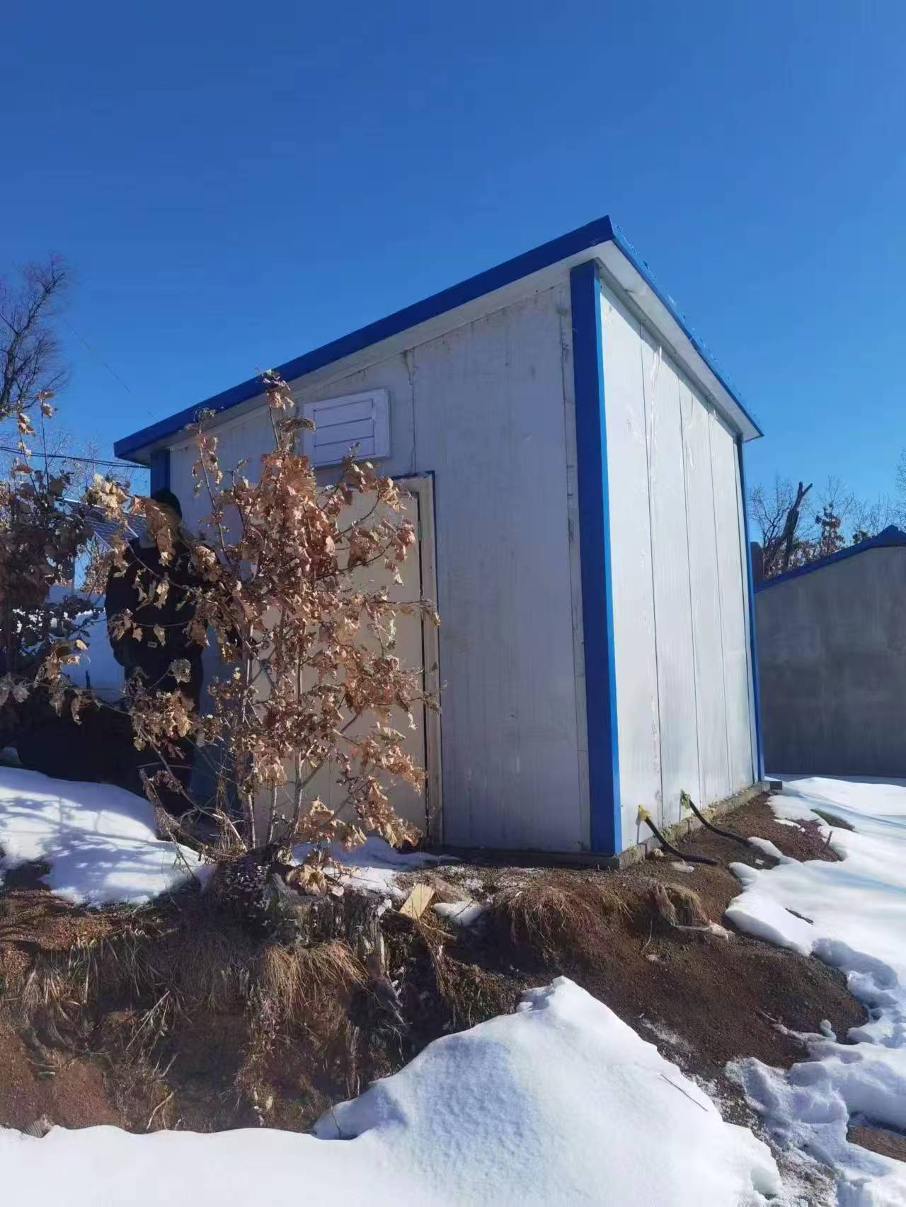 Gotopower's insulated outdoor equipment shelter protecting off-grid energy storage batteries in -40 degree weather.